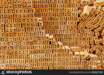 Pattern of stacked brown brick from abstract background. Building and construction backdrop.