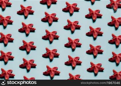 Pattern of starfish over a pastel blue background, minimalism, design and digital resource, background with copy space