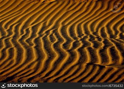 Patterns in the sand created by the wind
