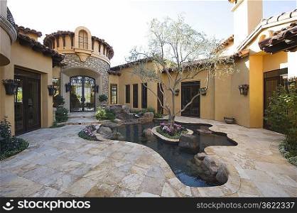 Paved courtyard garden with pool Palm Springs