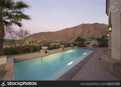 Paved poolside area of Palm Springs home