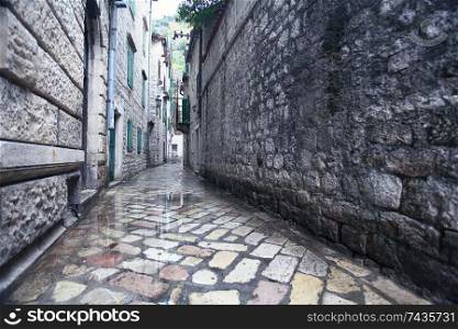 paved street stone walls Europe