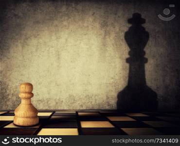 Pawn chess piece casting a shadow of a king on a concrete wall. Business aspirations and leadership concept. Magical transformation