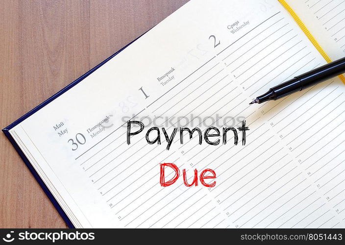 Payment due text concept write on notebook