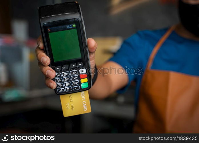 Payment over nfc technology,Customer making wireless or contactless payment using credit card,Buy and sell products & service.