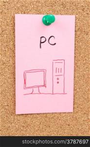 PC word and symbol drawn on paper and pinned on cork board