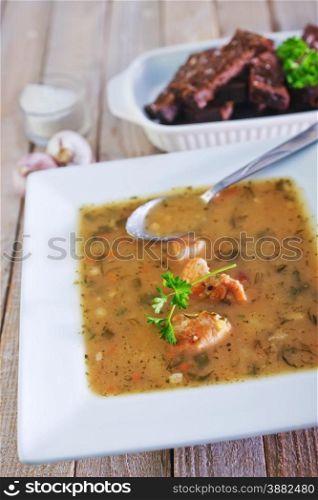 pea soup in white bowl and on a table