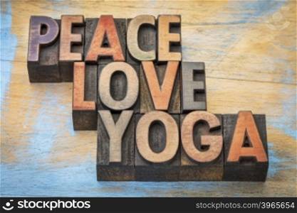peace, love and yoga word abstract - text in vintage letterpress wood type printing blocks
