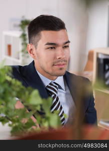 Peaceful asian caucasian businessman in office