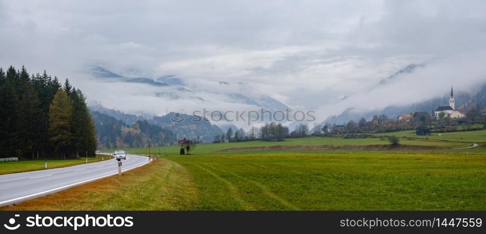 Peaceful autumn Alps mountain countryside panoramic cloudy overcast view, Felbertauern Strasse high alpine road, Matrei in Osttirol, Austria. Car and people unrecognizable.