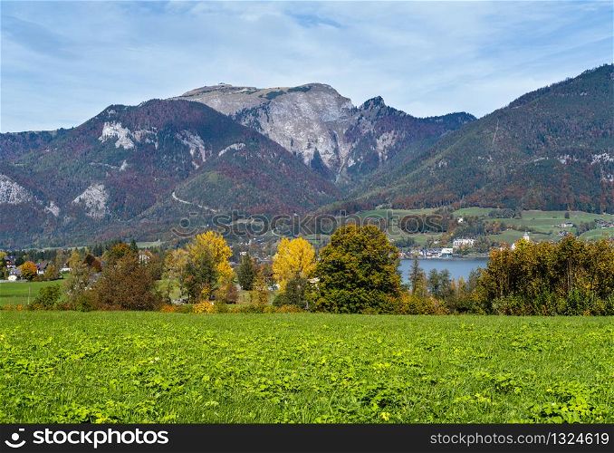 Peaceful autumn Alps mountain lake shore view. Wolfgangsee lake, Salzkammergut, Upper Austria.