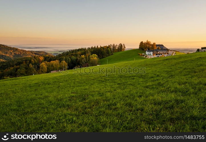 Peaceful autumn Alps mountain lake with clear transparent water and reflections. Sunrise view to Traunsee lake, Gmundnerberg, Altmunster am Traunsee, Upper Austria.