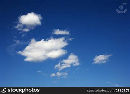 Peaceful clouds in blue sky.
