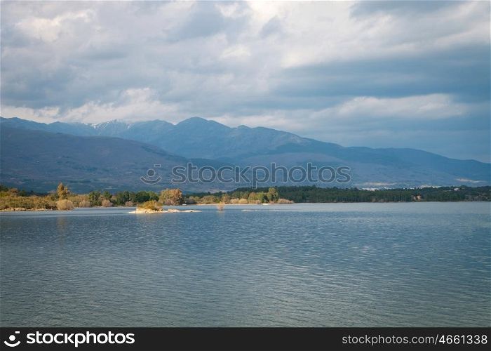 Peaceful lake at the foot of the Sierra de Gredos within Spain
