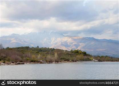 Peaceful lake at the foot of the Sierra de Gredos within Spain
