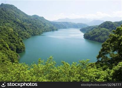 peaceful lake surround by forests and mountains. Asia, Taiwan