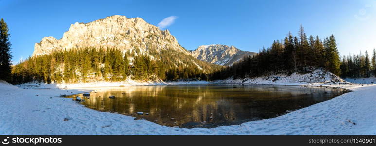 Peaceful mountain view with famous green lake in Austria Styria. Tourist destination lake Gruner See in winter. Travel spot situated in Tragos in lime stone Alps of Hochschwab.. Peaceful mountain panorama view with famous green lake in Austria Styria. Tourist destination lake Gruner See in winter.