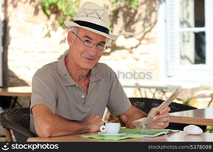 Peaceful retiree sitting at a table