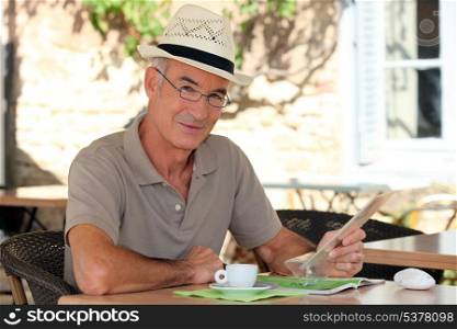Peaceful retiree sitting at a table