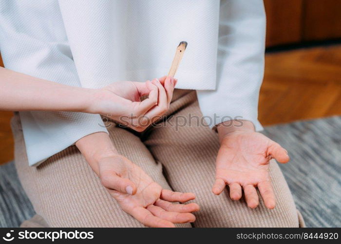 Peaceful Woman Sitting and Meditating, Spiritual Coach with Palo Santo Stick . Peaceful Woman Sitting and Meditating, Spiritual Coach with Palo Santo Stick.