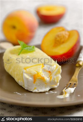 Peach ice cream on plate. Peach ice cream