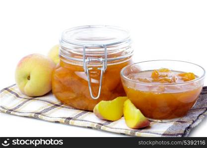 Peach jam with fresh fruits isolated on white