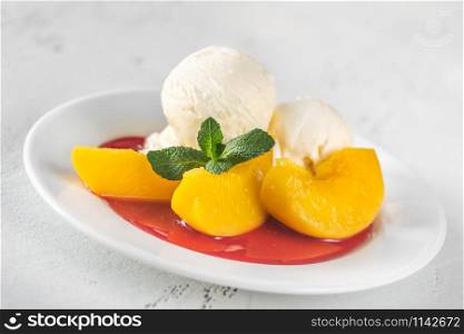 Peach Melba - dessert of peaches and raspberry sauce with vanilla ice cream