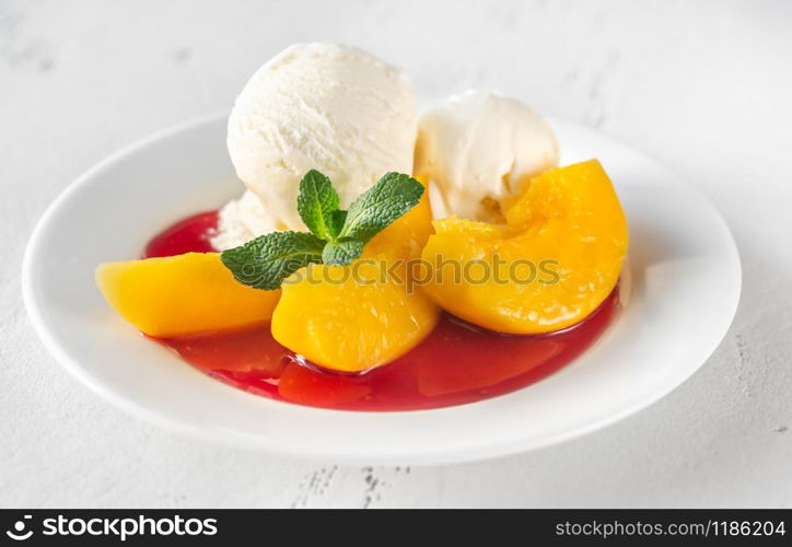 Peach Melba - dessert of peaches and raspberry sauce with vanilla ice cream