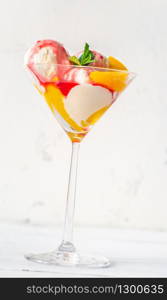 Peach Melba - dessert of peaches and raspberry sauce with vanilla ice cream
