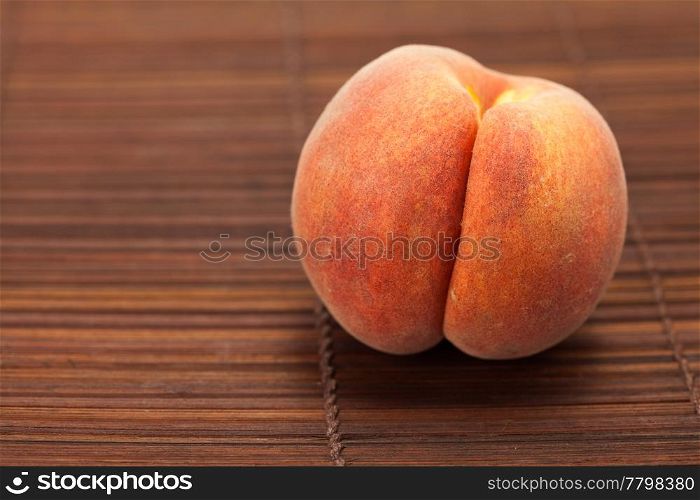 Peach on a bamboo mat