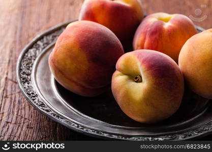 Peach . peach on an iron plate