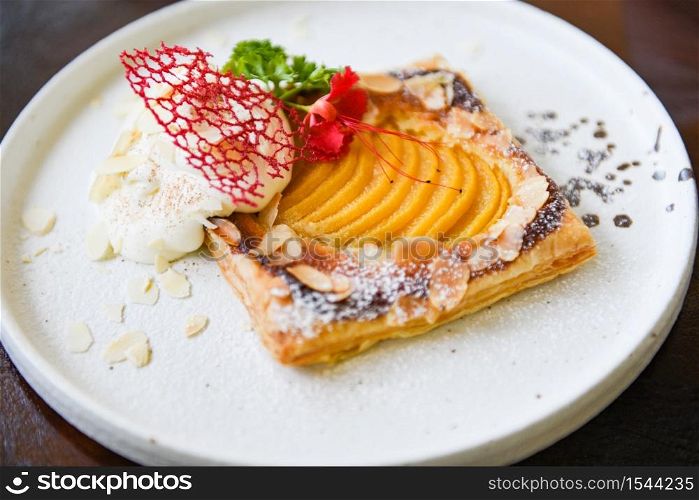 Peach Pie on white plate / Homemade dessert delicious cake with peaches and icing sugar