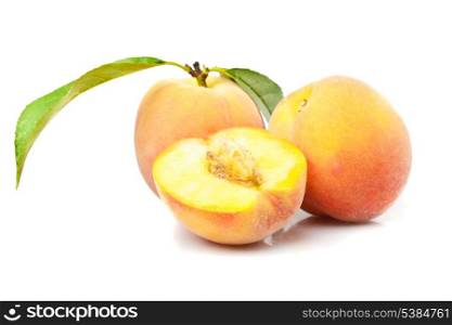 Peach with green leaves from tree isolated on white background