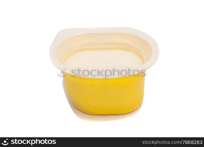 Peach yoghurt in open plastic cup isolated on white