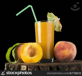 Peaches and glass with juice black isolated studio shot.