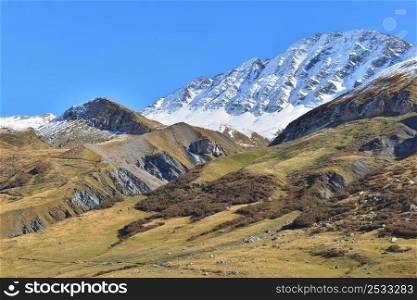 peak mountain covered with snow in alpine landscape in autumn