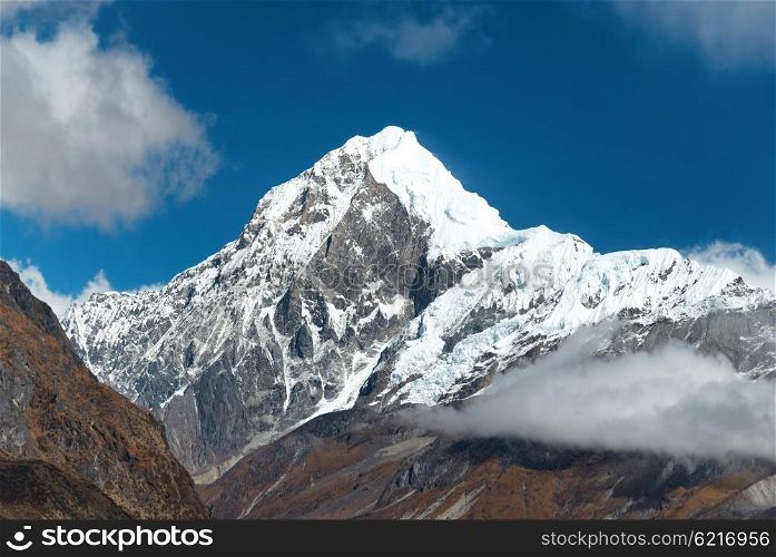 Peaks of high mountains, covered by snow. Kangchenjunga, India.