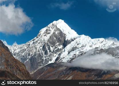 Peaks of high mountains, covered by snow. Kangchenjunga, India.