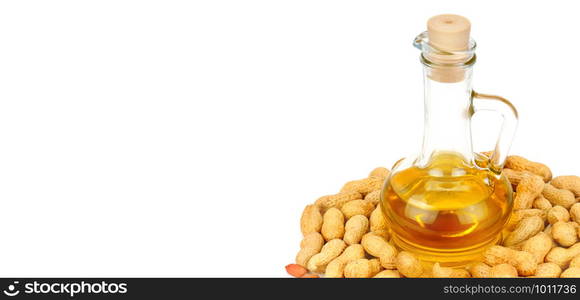 Peanuts and oil in bottle isolated on white background. Organic food. Free space for text. Wide photo.