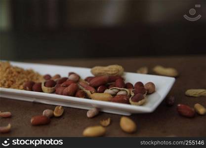 Peanuts in shells on wood background