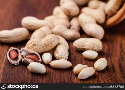 peanuts. Peanuts isolated on a wooden table
