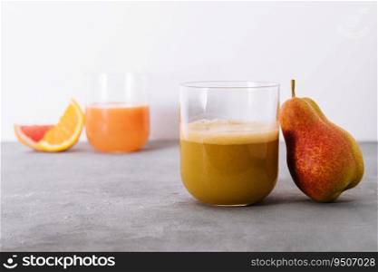 Pear Juice with fresh fruits close up