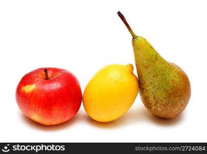 pear lemon and apple in row on white