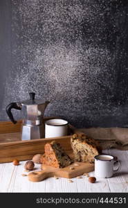 pear pie and tea with milk on a wooden table