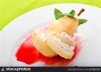 Pear with wine sauce in plate