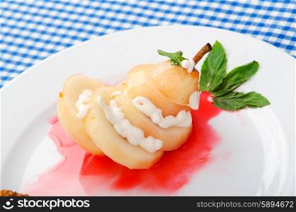 Pear with wine sauce in plate