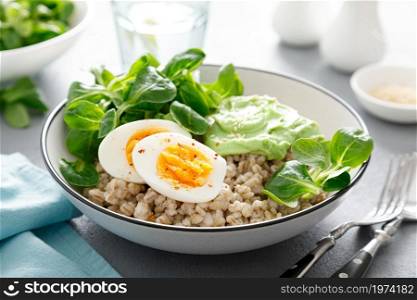 Pearl barley bowl with soft-boiled egg and corn salad