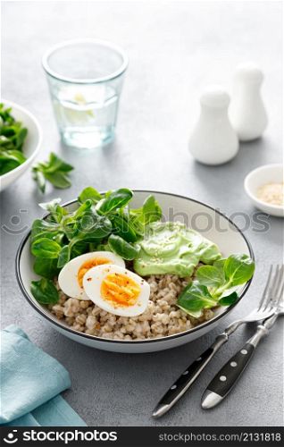 Pearl barley bowl with soft-boiled egg and corn salad