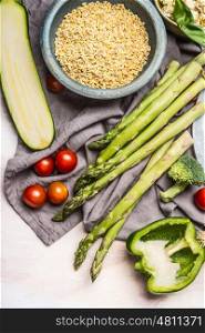 Pearl barley porridge or salad preparation with vegetables ingredients, top view. Healthy clean eating, vegan or vegetarian food or diet nutrition concept