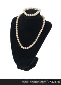 Pearl necklace and bracelet on a black velvet neck mold is an affordable luxury - path included